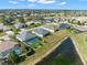 Aerial view showcasing lakefront homes with private pools and lush landscaping at 8874 Players Dr, Weeki Wachee, FL 34613