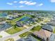 Aerial view of a luxury community with lakefront properties and spacious homes at 8874 Players Dr, Weeki Wachee, FL 34613