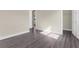 Well-lit bedroom with grey flooring and closet at 8874 Players Dr, Weeki Wachee, FL 34613