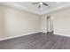 Bright bedroom with grey flooring and ceiling fan at 8874 Players Dr, Weeki Wachee, FL 34613