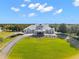 Resort-style clubhouse with lush landscaping at 8874 Players Dr, Weeki Wachee, FL 34613