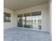 Covered patio with sliding glass doors leading to outdoor space at 8874 Players Dr, Weeki Wachee, FL 34613