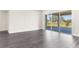 Bright living room with sliding glass doors and grey flooring at 8874 Players Dr, Weeki Wachee, FL 34613