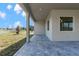 Covered patio with paver stones overlooking the backyard at 8874 Players Dr, Weeki Wachee, FL 34613