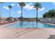 Community pool with lounge chairs and a pergola at 8874 Players Dr, Weeki Wachee, FL 34613