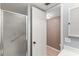Bathroom with shower stall and access to another room at 5111 Amulet Dr # 202, New Port Richey, FL 34652