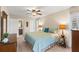 Bright bedroom featuring a king-size bed and ensuite bathroom access at 5111 Amulet Dr # 202, New Port Richey, FL 34652
