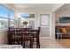 Bright dining area with table and chairs, near the living room at 5111 Amulet Dr # 202, New Port Richey, FL 34652