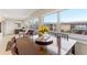 Bright dining area with large windows and seating for six at 5111 Amulet Dr # 202, New Port Richey, FL 34652