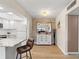 Bright dining area with hardwood floors and a stylish mirror at 5111 Amulet Dr # 202, New Port Richey, FL 34652