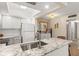 Modern kitchen features white cabinets, granite countertops, and stainless steel appliances at 5111 Amulet Dr # 202, New Port Richey, FL 34652