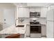 Updated kitchen, featuring granite countertops and stainless steel appliances at 5111 Amulet Dr # 202, New Port Richey, FL 34652