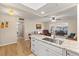 Open concept kitchen with granite island, stainless steel sink, and views into living area at 5111 Amulet Dr # 202, New Port Richey, FL 34652