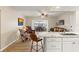 Open concept kitchen and living area with granite counters and hardwood floors at 5111 Amulet Dr # 202, New Port Richey, FL 34652