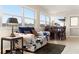 Bright living room with window views, sofa, and dining area at 5111 Amulet Dr # 202, New Port Richey, FL 34652