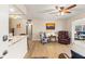 Bright living room with hardwood floors, comfortable seating, and access to a balcony at 5111 Amulet Dr # 202, New Port Richey, FL 34652