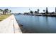 Another scenic waterfront view with boats and walkway at 5111 Amulet Dr # 202, New Port Richey, FL 34652