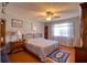 Comfortable bedroom with ceiling fan and wood furniture at 12607 Pecan Tree Dr, Hudson, FL 34669