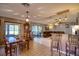 Bright dining area with wood table and access to the living room at 12607 Pecan Tree Dr, Hudson, FL 34669