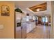 Bright kitchen featuring stainless steel appliances and wood accent ceiling at 12607 Pecan Tree Dr, Hudson, FL 34669