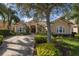 Beautiful home exterior with lush landscaping and driveway at 1453 El Pardo Dr, Trinity, FL 34655