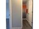Small bathroom with shower and gray cabinets at 5930 Precious View Ct, New Port Richey, FL 34655