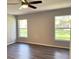Spacious bedroom with two windows and ceiling fan at 5930 Precious View Ct, New Port Richey, FL 34655