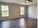 Bright bedroom with two windows and ceiling fan at 5930 Precious View Ct, New Port Richey, FL 34655