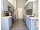 Modern kitchen with gray cabinets and stainless steel appliances at 5930 Precious View Ct, New Port Richey, FL 34655