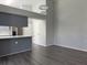 Modern kitchen with grey cabinets and quartz countertops at 5930 Precious View Ct, New Port Richey, FL 34655