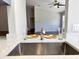 Stainless steel kitchen sink with modern faucet at 5930 Precious View Ct, New Port Richey, FL 34655
