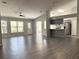 Open concept living area with new flooring and access to the backyard at 5930 Precious View Ct, New Port Richey, FL 34655