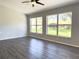 Living room with large windows and backyard view at 5930 Precious View Ct, New Port Richey, FL 34655
