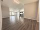 Spacious living area with new flooring, lots of natural light, and view of kitchen at 5930 Precious View Ct, New Port Richey, FL 34655