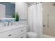Bathroom with white vanity, toilet, and bathtub at 2241 Merion Ct, Spring Hill, FL 34606