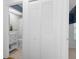 Small bathroom with toilet and shower. White vanity and linen cabinet at 2241 Merion Ct, Spring Hill, FL 34606