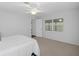 Bedroom with neutral wall and carpet flooring, and access to exterior at 2241 Merion Ct, Spring Hill, FL 34606