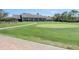 Community clubhouse with putting green in front at 2241 Merion Ct, Spring Hill, FL 34606