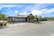 Modern community building with parking and landscaping at 2241 Merion Ct, Spring Hill, FL 34606