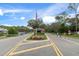 Gated entrance to the community with landscaping at 2241 Merion Ct, Spring Hill, FL 34606
