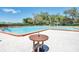 Relaxing community pool with a spacious deck and seating at 2241 Merion Ct, Spring Hill, FL 34606