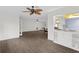 Open concept dining area with kitchen pass through and hardwood floors at 2241 Merion Ct, Spring Hill, FL 34606