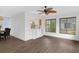 Open dining area with kitchen pass-through and hardwood floors at 2241 Merion Ct, Spring Hill, FL 34606