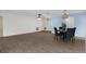 Bright dining area with a round table and four chairs, hardwood floors, and ceiling fan at 2241 Merion Ct, Spring Hill, FL 34606