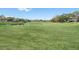 Landscaped golf course with a pond and lush greenery at 2241 Merion Ct, Spring Hill, FL 34606