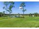 Scenic golf course view with pond and lush greens at 2241 Merion Ct, Spring Hill, FL 34606