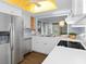 Modern kitchen with stainless steel appliances and white cabinets at 2241 Merion Ct, Spring Hill, FL 34606