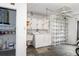 Laundry room with washer, dryer, and storage shelves at 2241 Merion Ct, Spring Hill, FL 34606