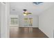 Bright and airy living room with hardwood floors and French doors at 2241 Merion Ct, Spring Hill, FL 34606