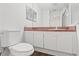 Bathroom with toilet, sink, and shower at 9131 Haas Dr, Hudson, FL 34669